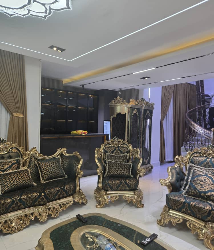 Luxury sitting room with custom seating and display cabinetry