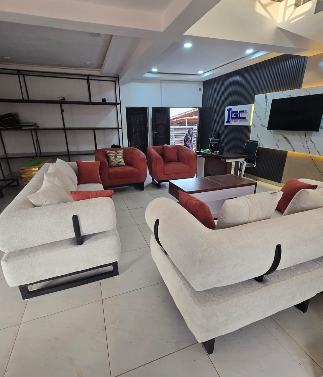 White and Rust Showroom Arrangement I by IGC Construction Company Ltd