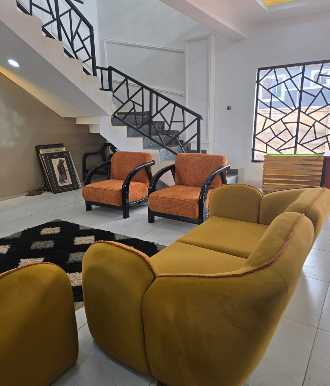 Mustard Lounge and Timber Accent Chairs by IGC Construction Company Ltd
