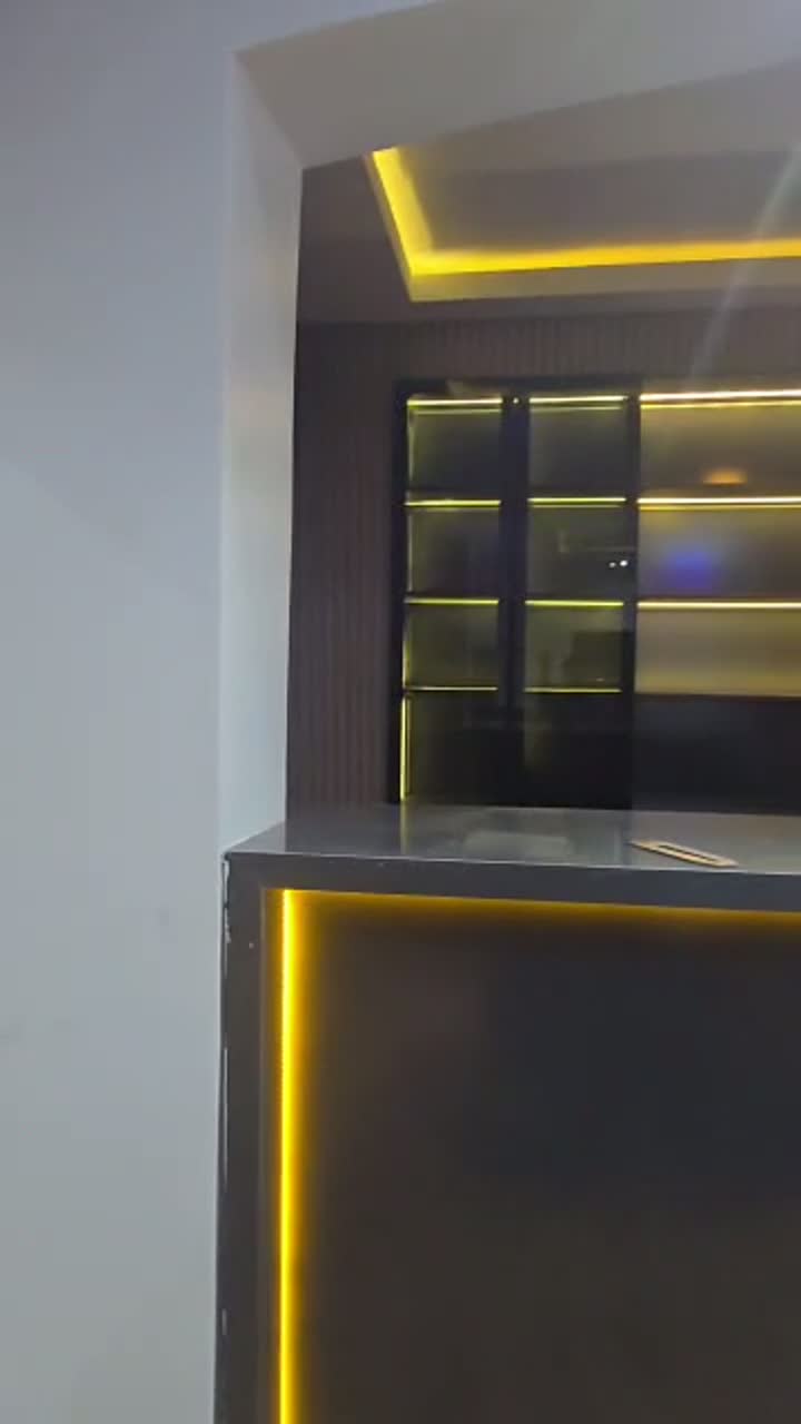 Custom cabinetry and shelving with ambient lighting