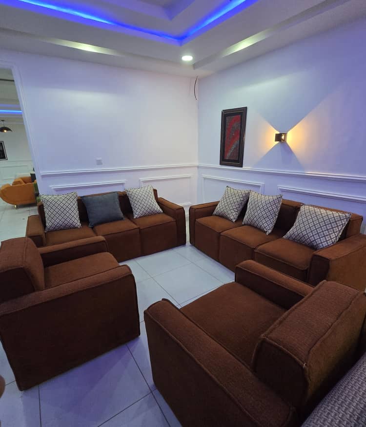 Brown Lounge Suite with Ambient Lighting by IGC Construction Company Ltd