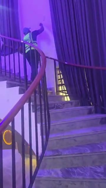 Curved staircase with ambient feature lighting