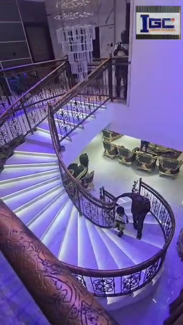 Finished illuminated staircase and grand foyer
