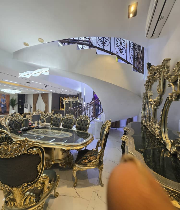 Open-plan luxury dining room and curved staircase